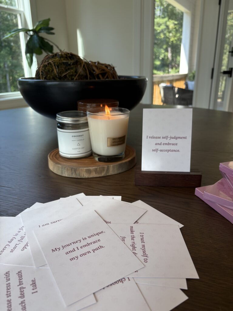 Close-up of colorful workplace affirmation cards arranged on a desk, designed to promote stress relief, focus, and team wellbeing.