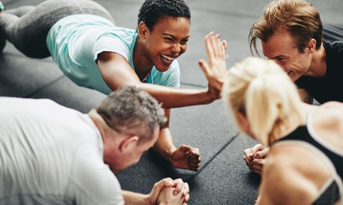 Employees participating in a group wellness activity, symbolizing how connected HR systems support engagement and wellbeing
